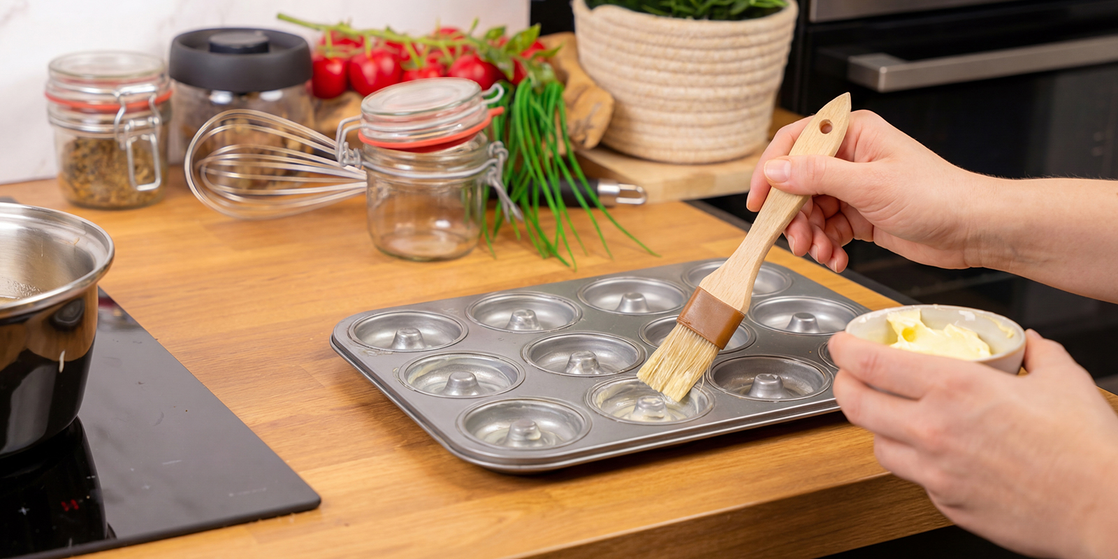 Lightly grease the doughnut pan with butter or oil to keep the doughnuts from sticking